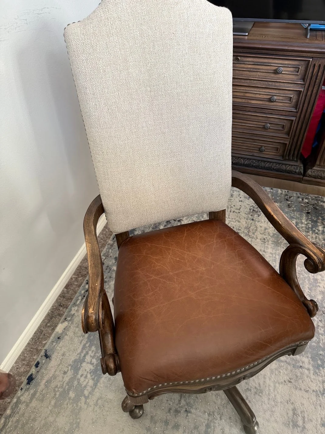 Restored wooden home-office chair after all five failed casters were replaced with custom-milled replacements.