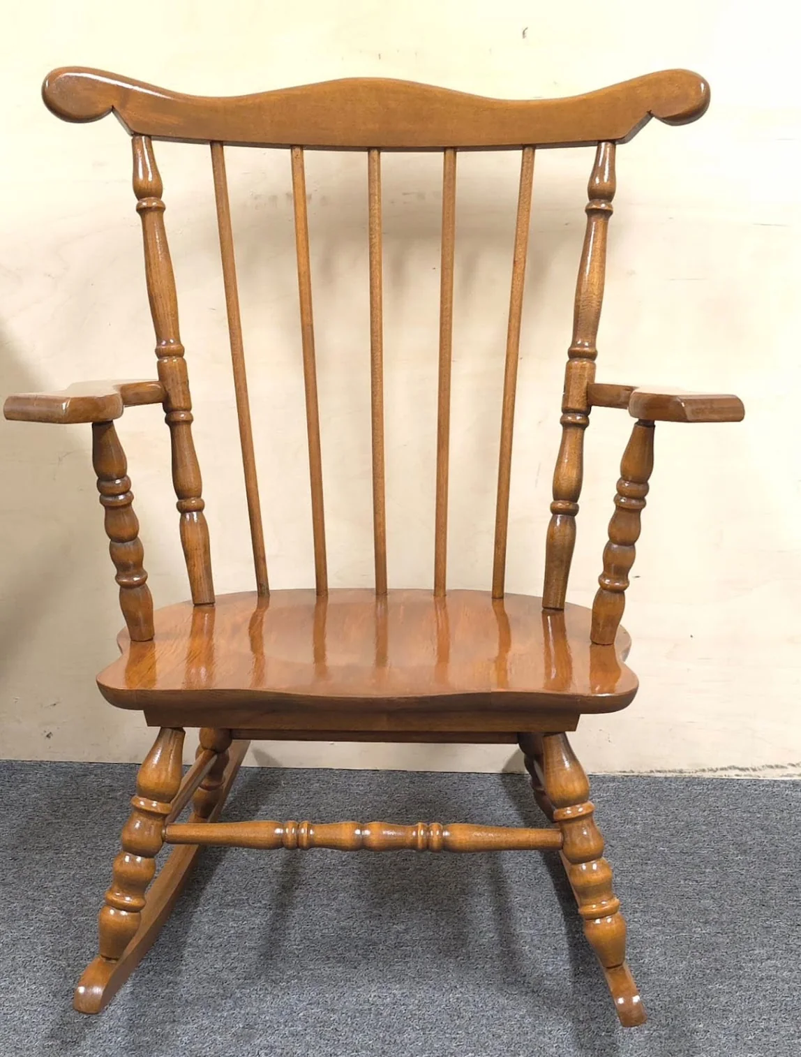 Restored vintage child rocking chair prepared for the third generation of one family.