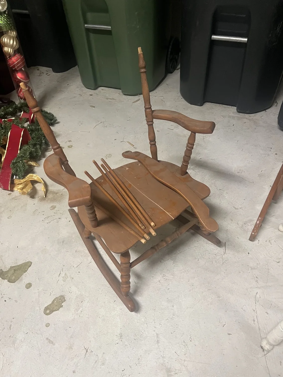 Disassembled vintage child rocking chair before reconstruction and restoration.