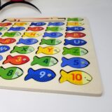 Handcrafted wooden toy with fish magnets for interactive learning