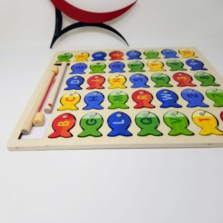 Wooden toy game with magnetic fish for developing hand-eye coordination