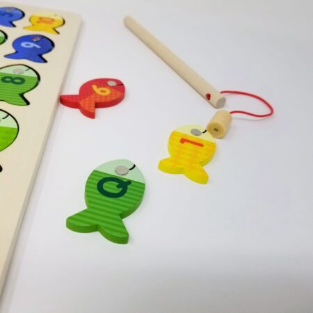 Wooden toy with fish magnets for shape recognition and imaginative play.